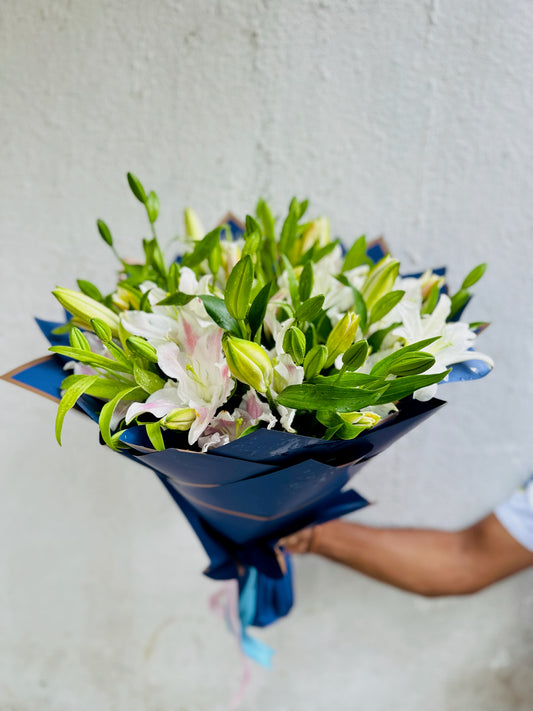 Lily hand bouquet by BloomOnly who is a premium number 1 florist in pune that delivers same day