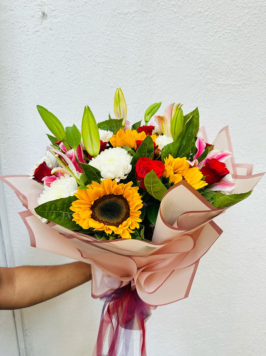 Mix flowers hand bouquet by BloomsOnly, Pune's number 1 flower delivery website