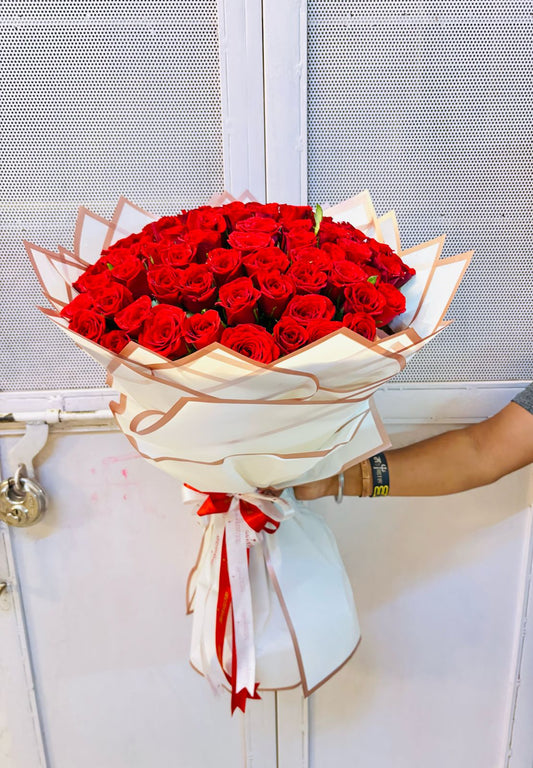 100 Red Roses hand bouquet by BloomsOnly, Pune's number 1 flower delivery website