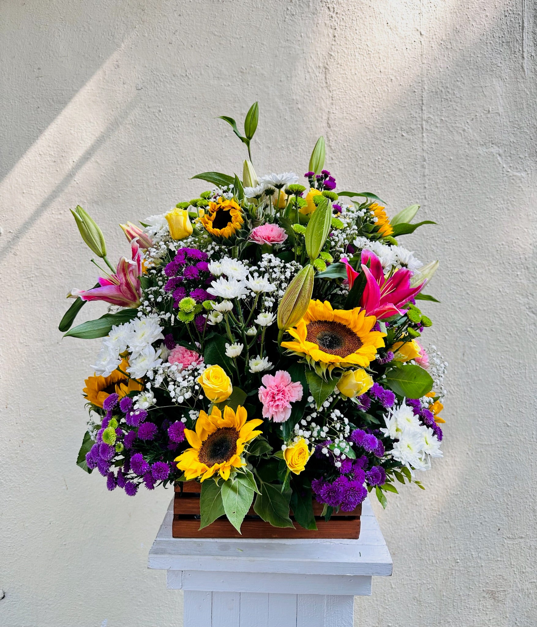 Wooden basket mix flowers by BloomsOnly, Pune's number 1 flower delivery website