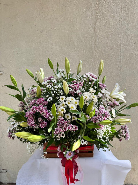 Wooden basket mix arrangement by BloomsOnly, Pune's number 1 flower delivery website