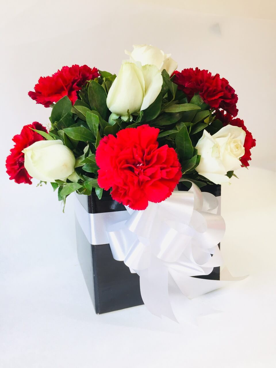 Carnations and Roses in Black Box