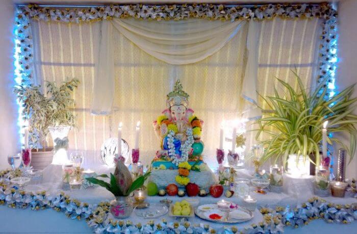 Ganpati Decoration With Glasses And Candles | Blooms Only Pune Blog