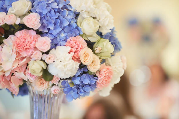 Wedding bouquets at dinner tables